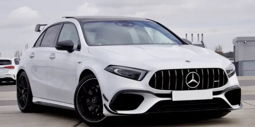 White luxury car with sleek design on display.